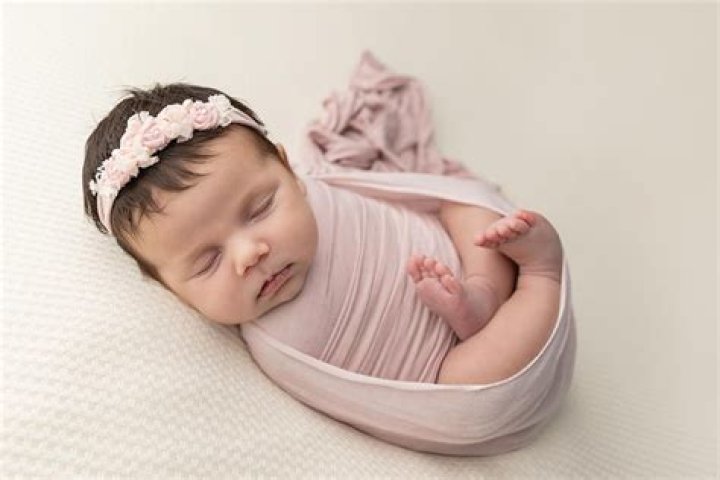 What do photographers wrap newborns?